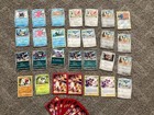 Assorted Pokémon cards stage 1+2, 2 trainers, and charzard cases — photo 1