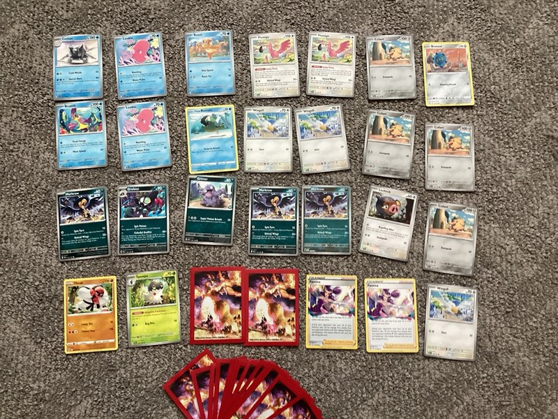 Assorted Pokémon cards stage 1+2, 2 trainers, and charzard cases