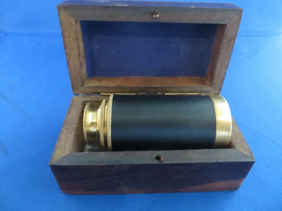 A brass captain's collapsible spyglass in a wooden presentation box — ready to gift straight off the shelf.