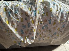 Vintage baby Crib sheet Set Of 2 with a repeating cartoon animal print.