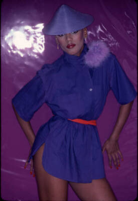 Fashion Model Toukie Smith As She Poses Against A Purple Backgroun- Old Photo