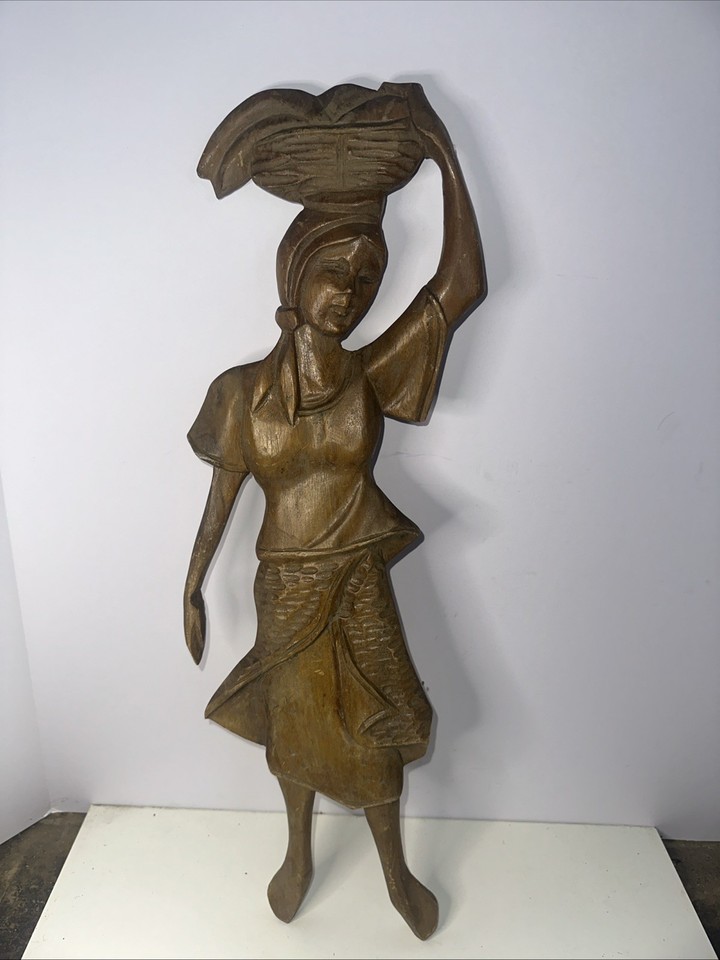 A genuine 1950s hand-carved teak relief wall art panel — mid-century craftsmanship that's sculptural, tactile, and impossible to find at a big-box store.