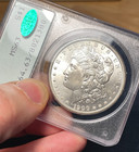 (#102396) Morgan Dollar: 1900 PCGS MS 63 CAC.  rattler.  OGH.   (see video!) — photo 1