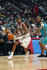 Jalen Rose Chicago Bulls drives past Courtney Alexander New Orlea- 2002 Photo