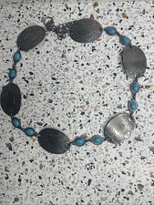 chain concho belt featuring silver-tone medallions and faux turquoise stones