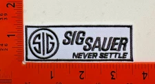 Sig Sauer “Never Settle” Embroidered Iron‑On/Sew‑On Patch – Tactical Gear