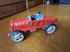 VINTAGE RED CAST IRON RACE CAR WITH DRIVER