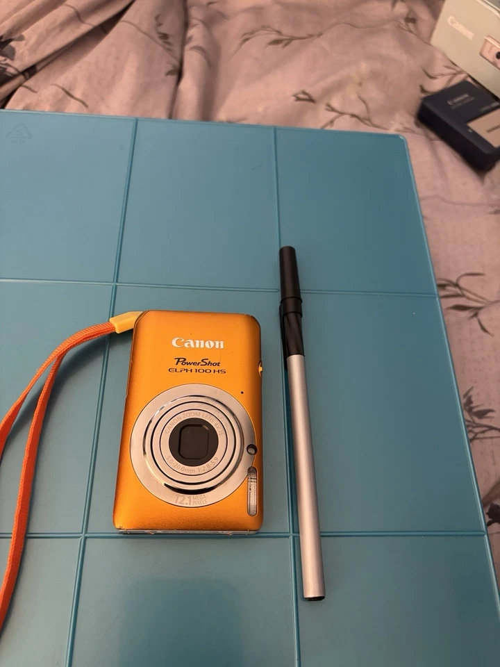 Cámara excavadora Canon ELPH-100hs-naranja-12,1 MP-tarjeta SD y accesorios en caja-exc. Foto 3 de 4