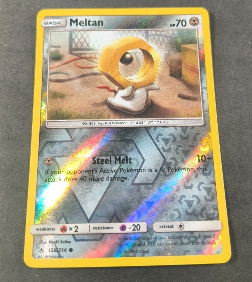 Pokemon Unbroken Bonds Meltan Reverse Holo Common Card 128/214 NM