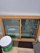replacement windows two light slider. Woodgrain interior. Low-e/argon, etched gl