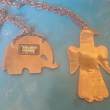 AO and elephant handcrafted made out of brass. Necklace