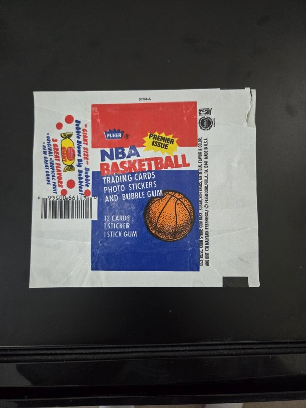 1986 Fleer Basketball Wax Wrapper Jordan RC Year. Rip Upper Right Corner.   (U)