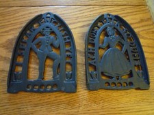 Lot of 2 Vintage Black Cast Iron Art Footed Trivets Sad Irons Dutch Man  Woman