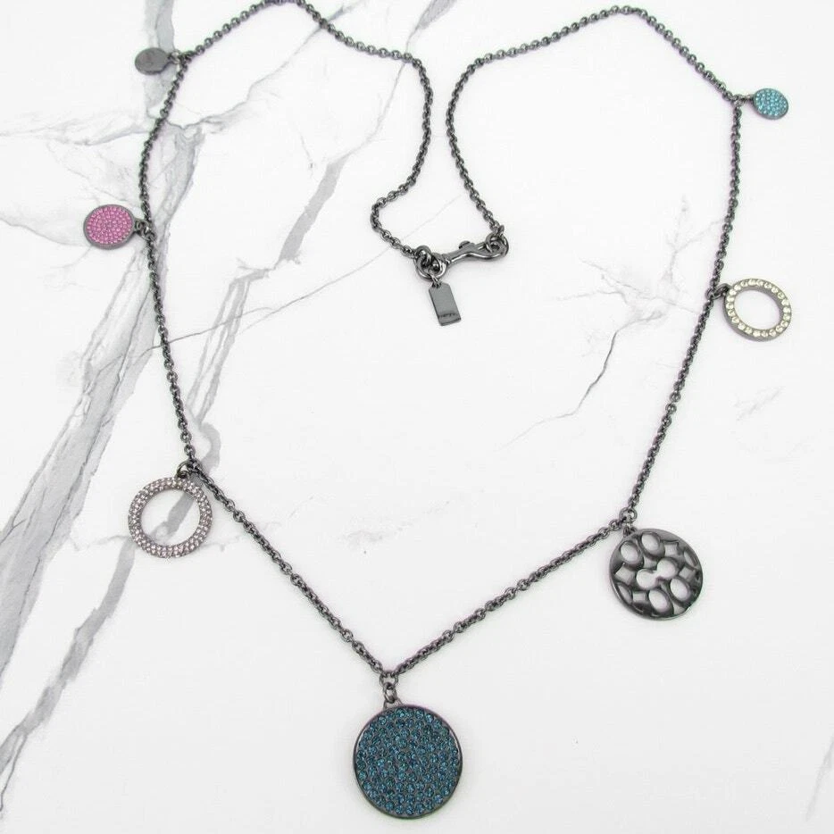 Collana con ciondolo disco multipave Coach