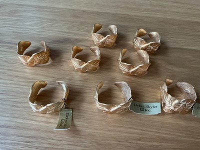 Goldfarbene Serviettenringe von Debra Skyler x 8 Blattmuster, Manschettenstil sehr guter Zustand