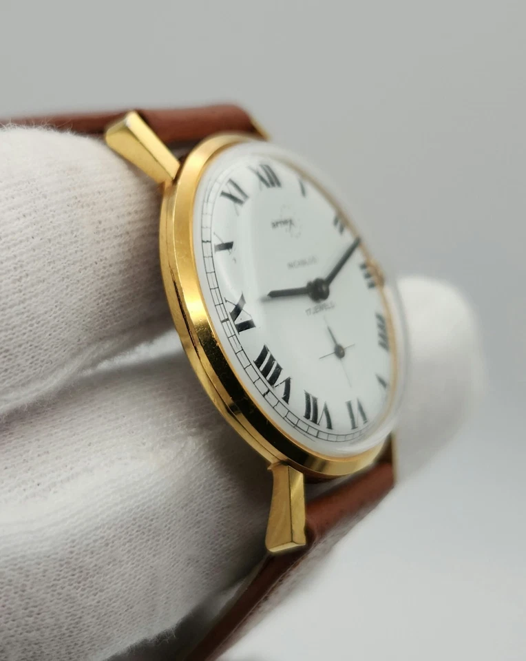 Reloj mecánico Arnex vintage para hombre tono dorado con esfera blanca y números romanos Foto 2 de 4