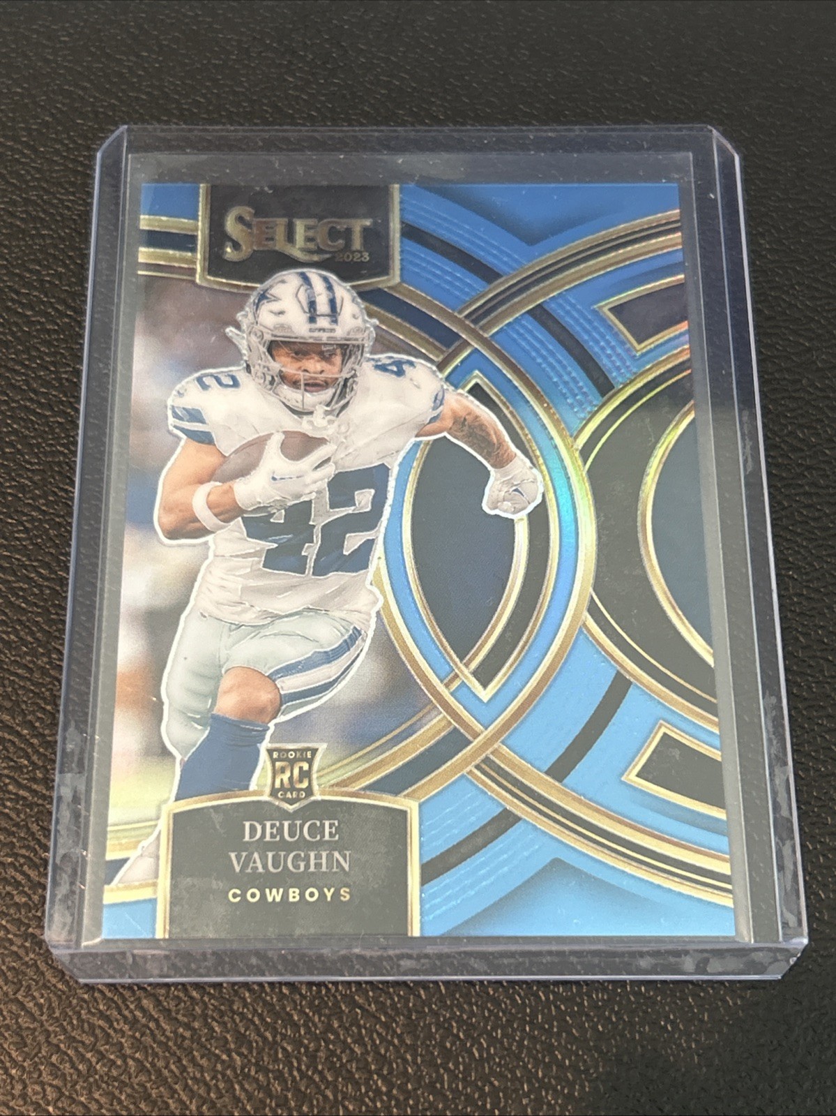 2023 Panini Select - Premier Level Deuce Vaughn #128 Light Blue Prizm /99 (RC)