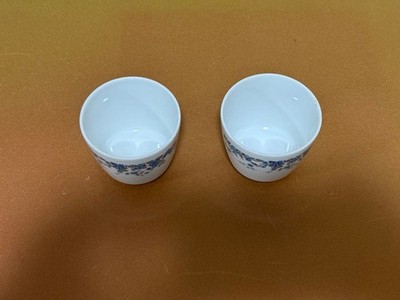 Noritake teacup set of 2 with blue floral pattern on white background