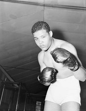 Joe Louis strikes an intimidating pose at his training camp in Pom- Old Photo
