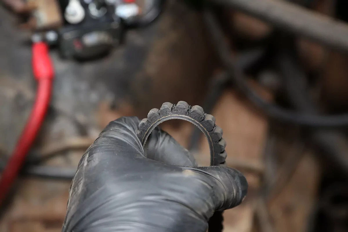 A V-belt with cracks in the rubber.