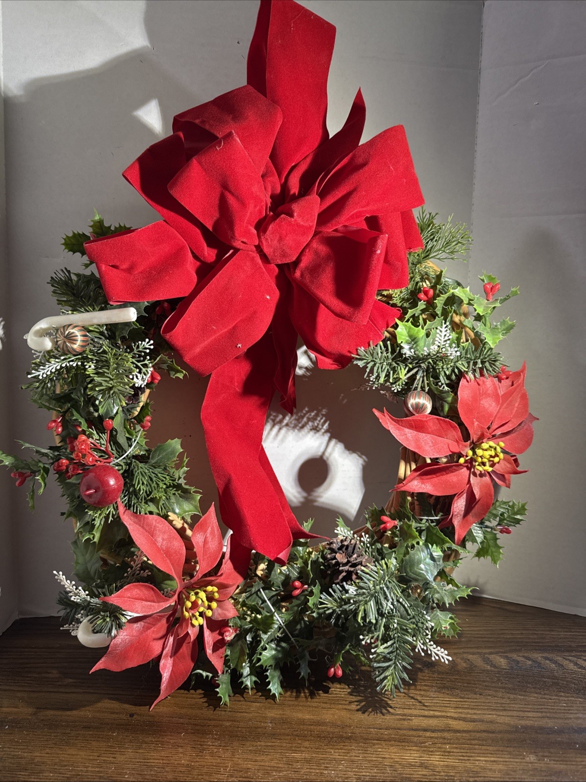 Festive Woven Christmas Wreath with Red Bow and Holly