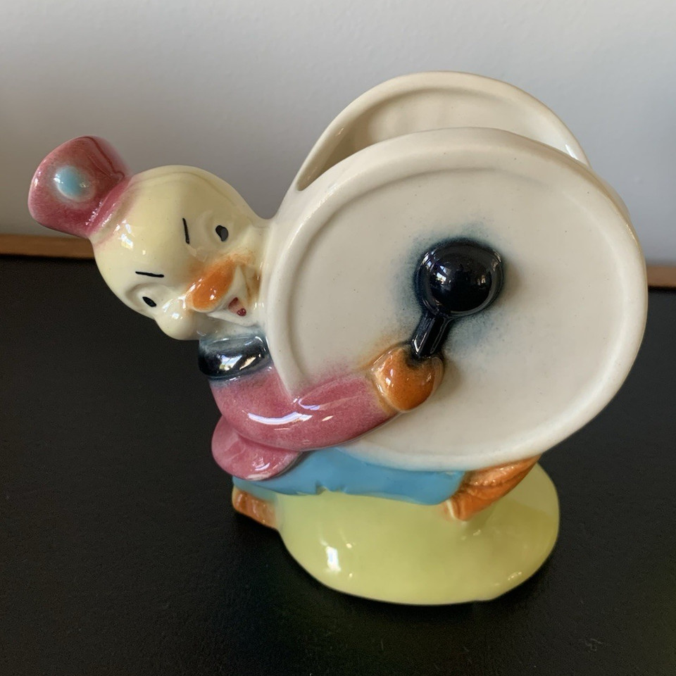 A 1950s ceramic duck in a marching band uniform is peak mid-century absurdist décor — a genuine conversation piece that costs less than dinner.
