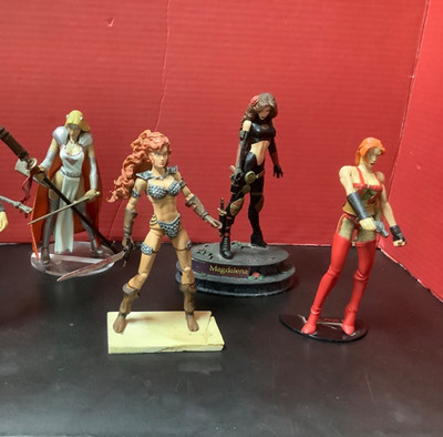4 comic figures-red sonja, Magdalena, Scarlett X, Lady Pendragon