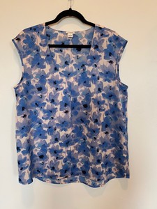 white satin sleeveless blouse