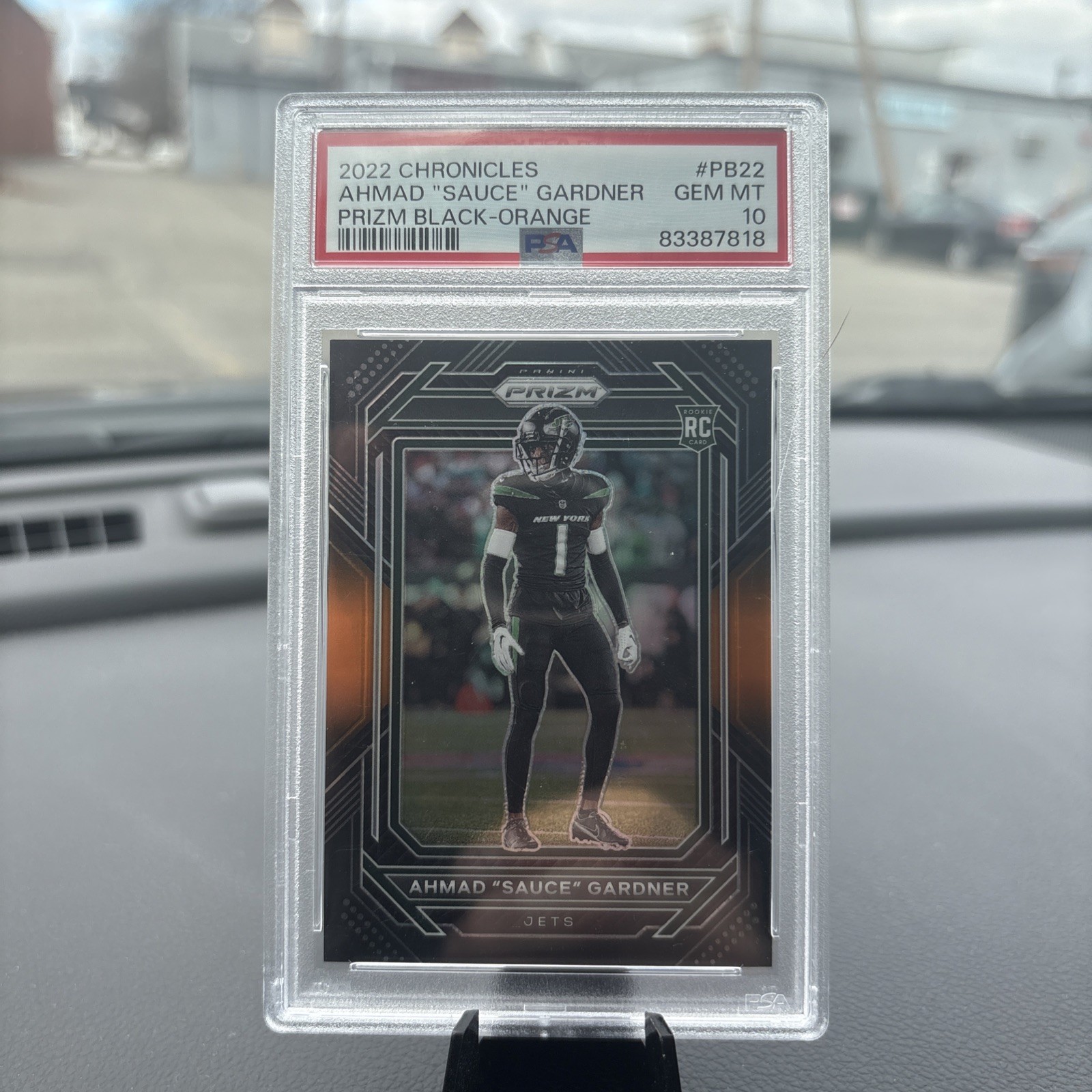 2022 Panini Chronicles Ahmad “Sauce” Gardner Prizm Black Orange /75 PSA 10