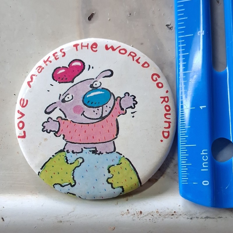 "Love Makes the World Go Round" Humorous Pinback Button Cartoon Dog on Globe