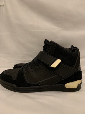 gold and black sneakers