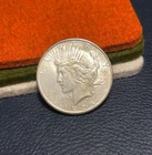 (#102140) Peace Dollar:  1925 S.  AU  Whitman book toning    (See video!)