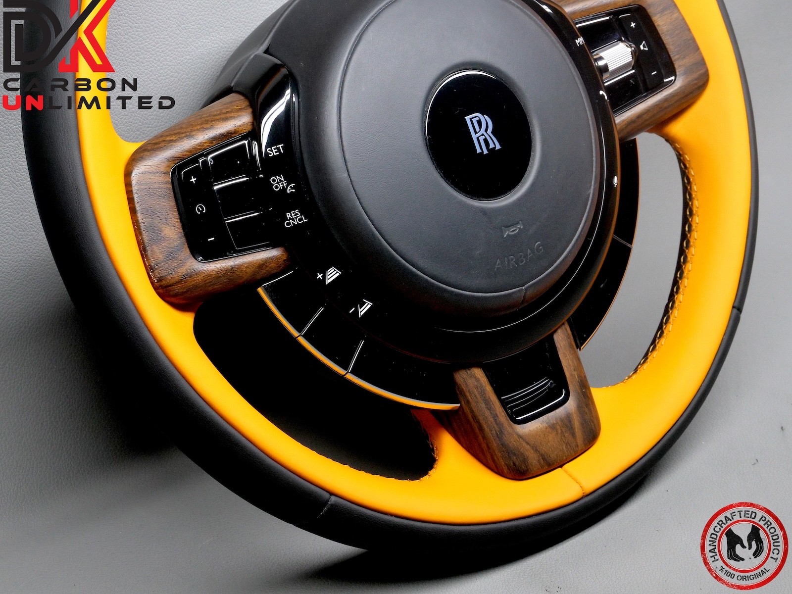Rolls Royce Spectre Thick Rimmed Two Tone Black & Mandarin Stitch Steering Wheel