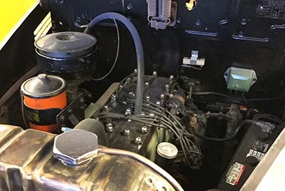 Four cylinders (with a three-on-the-tree) power the Pontiac Business Coupe.