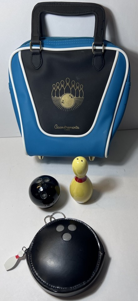 A tiny teal-and-black Accoutrements novelty bowling ball bag purse — functionally absurd and visually perfect.