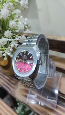 Vintage Ricoh Crystal automatic wristwatch with red/pink dail