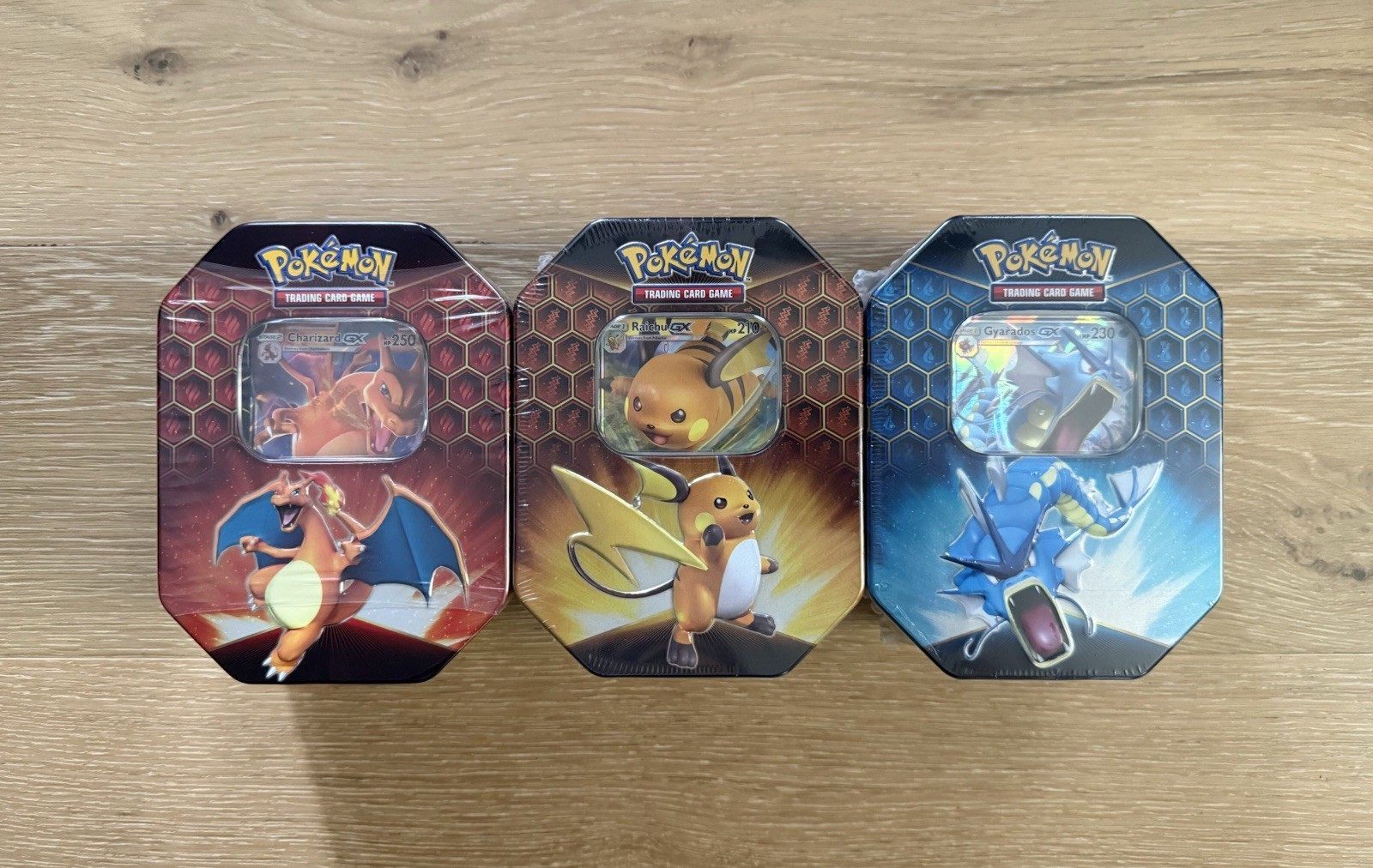 Pokémon Hidden Fates GX Tins Art Set of 3 Sealed - Charizard Raichu Gyarados
