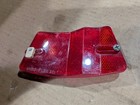 Red vintage 1970s 1980s Micro-Flex bike rim reflector with dual reflectors and mounting hole, made in USA.