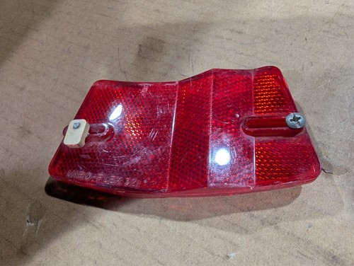 Red vintage 1970s 1980s Micro-Flex bike rim reflector with dual reflectors and mounting hole, made in USA.