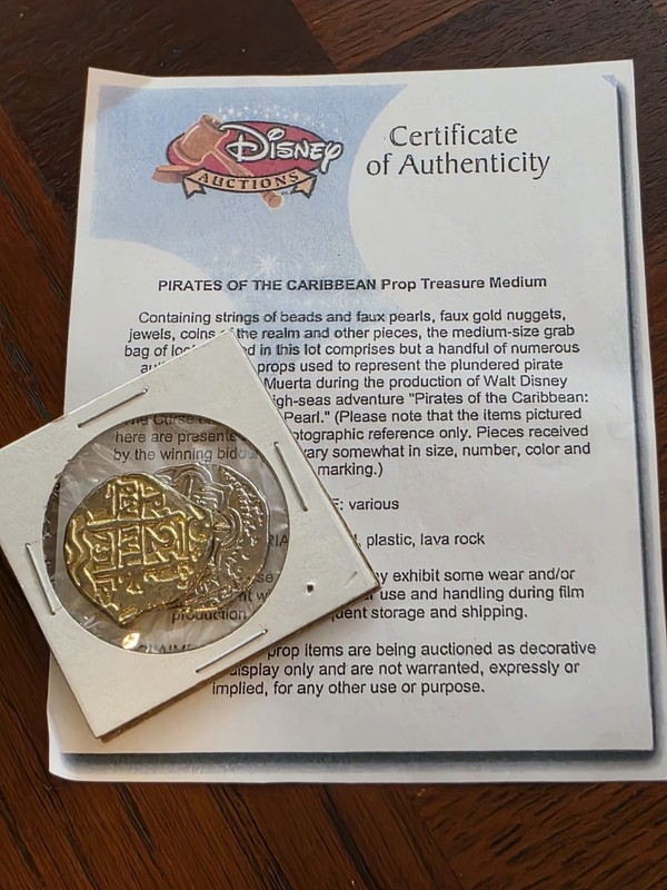 Disney Auctions Pirates of the Caribbean Movie Prop Treasure COA + 2 Coins
