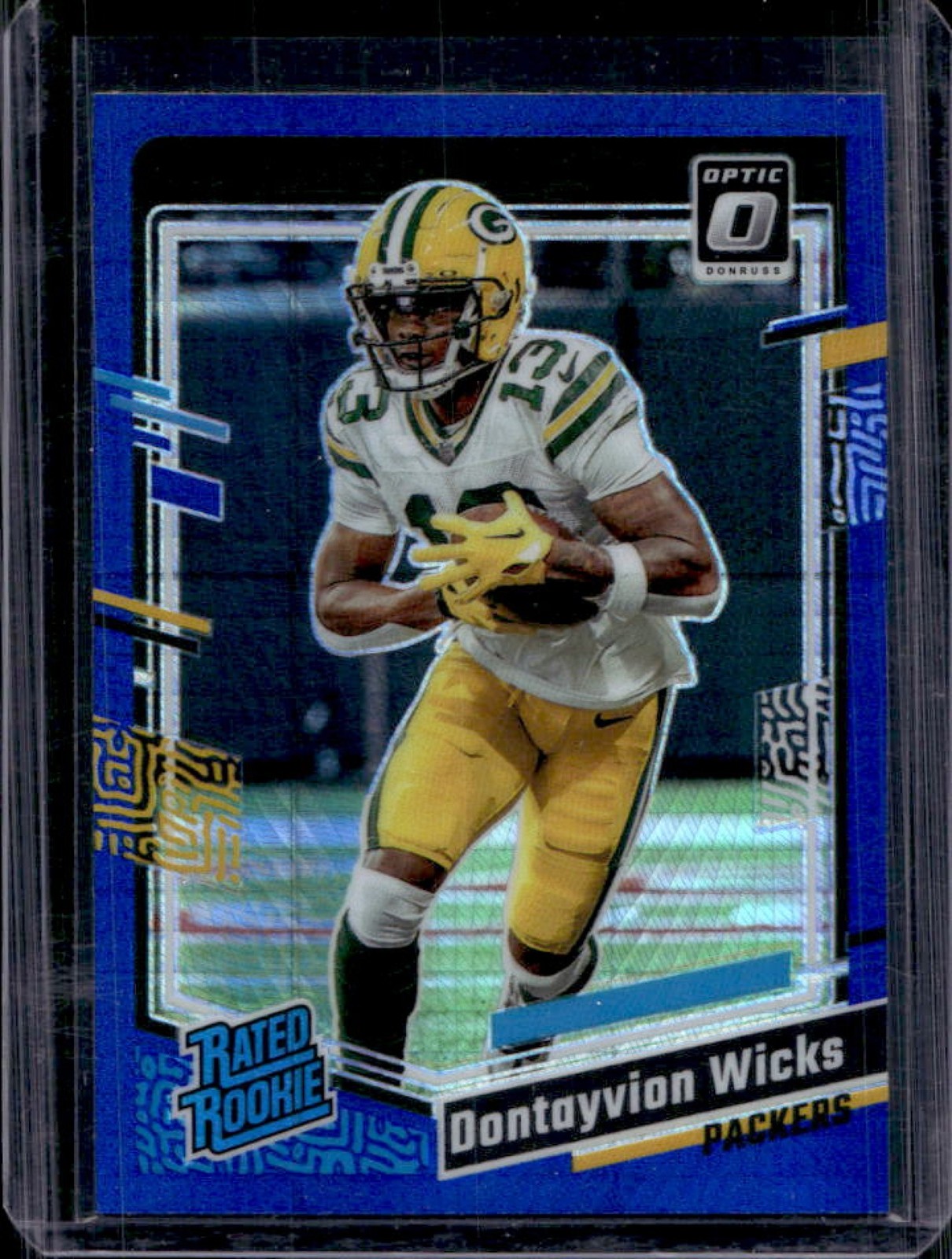 2023 Donruss Optic Dontayvion Wicks Blue Hyper Prizm Rated Rookie #249 Packers