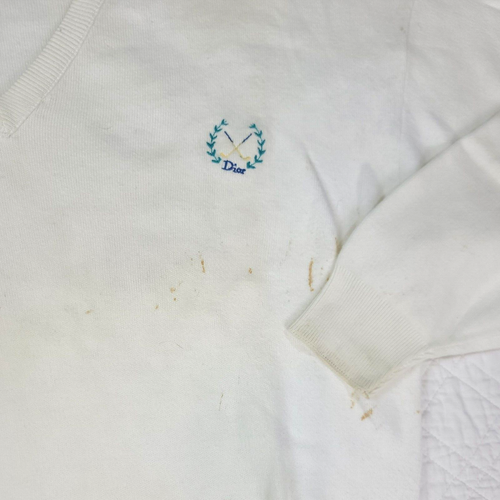 White VTG Christian Dior men’s V-neck sweater with blue embroidered logo and crosshatches on chest, made in USA.