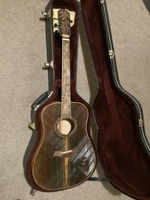 Blueberry dreadnought guitar with bird carvings