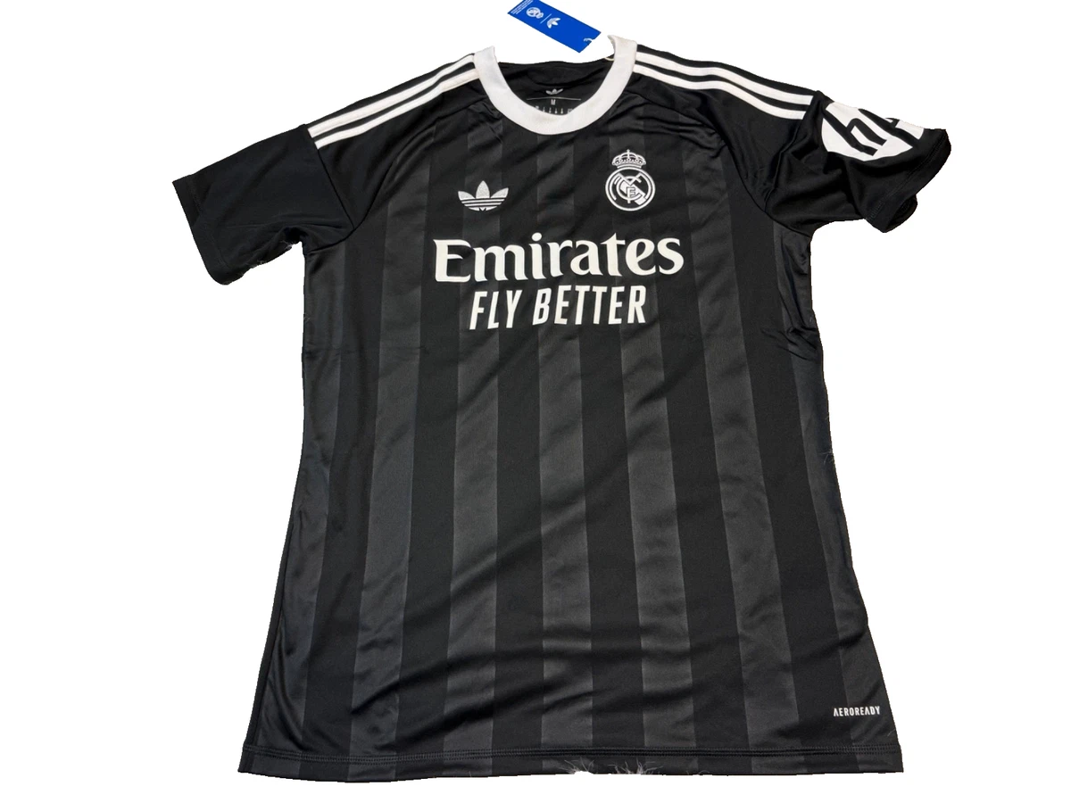 Preços baixos em Real Madrid Black International Club Camisas de