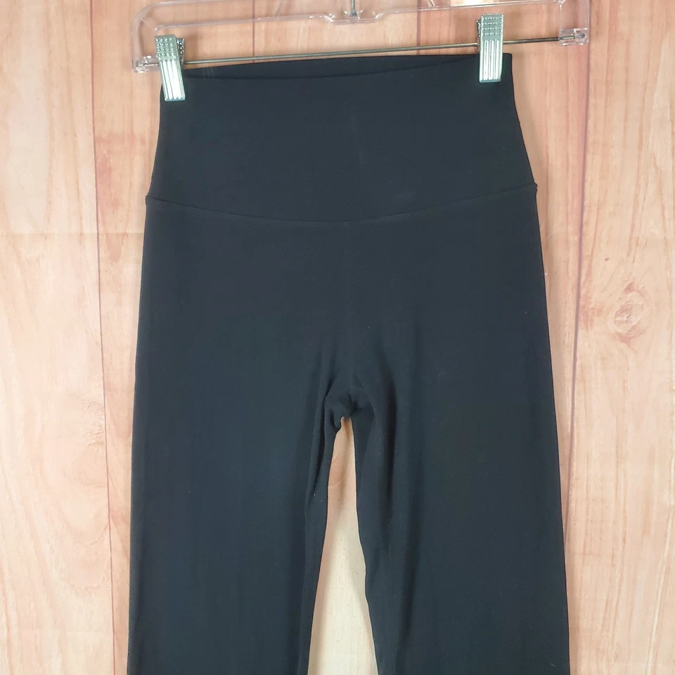 Splits59 Raquel Leggings Acampanados Mujer Pequeños Negros Elastizados Logo Calce Cruzado Entrenamiento Foto 3 de 4