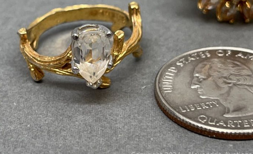 Heavy gold electroplated fashion ring with clear stone, some fading