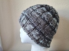 Hand knitted cozy and warm hat, gradient gray tones