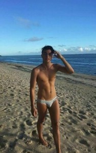 men in speedos on the beach