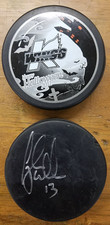 Kalamazoo Wings Hockey Pucks - Happy Halloween and Black Game Puck - Used