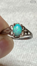  147B- .55ct Genuine Ethiopian Welo Opal set in a Size 8 Sterling Silver Ring